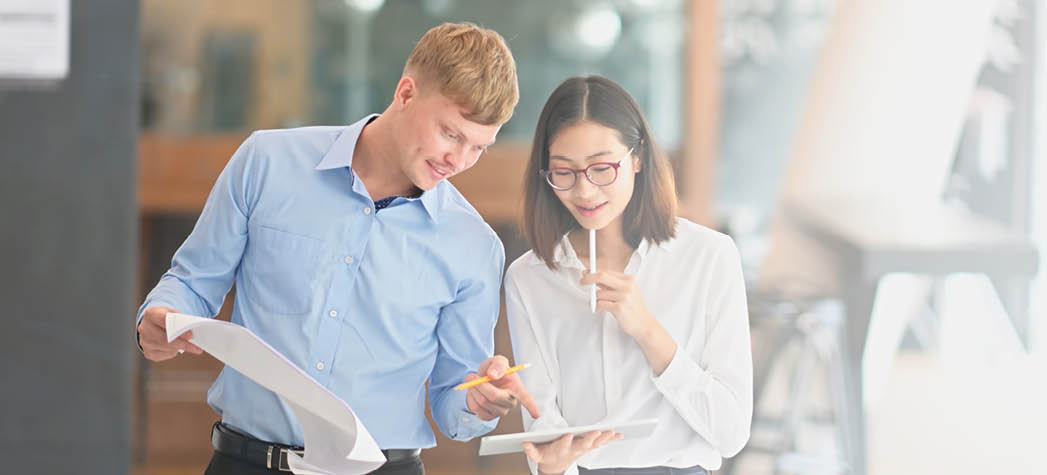 Engineer and Architect team planning and discussing about construction building on table 